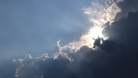 Low angle view TimeLapse of Beautiful sunny blue sky with bright sun shining on tropical summer horizon in vibrant sunlight, sunbeam n sun ray flares with white cumulus clouds at midday sunshine day - Powered by Shutterstock - Get 15% off with code: PIKWIZARD15