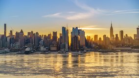Midtown Manhattan skyline at sunrise in New York, timelapse of rising sun - Powered by Shutterstock - Get 15% off with code: PIKWIZARD15