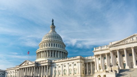 Timelapse US Capitol in Washington DC over blue sky