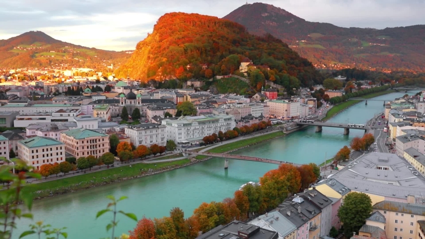 Attractive evening cityscape of Salzburg, Old City, birthplace of famed composer Mozart. Aerial autumn scene of  Eastern Alps.Splendid  landscape with Salzach river. Full HD video (High Definition).