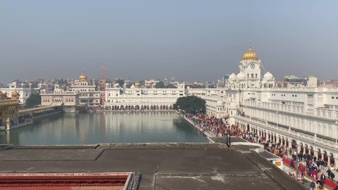Amritsar India - Febuary 8, 2020: Sikh Golden Temple (sri harmandir sahib), with crowds of people paying respects and praying
