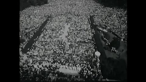 CIRCA 1963 - Thousands participate in the March on Washington for Jobs and Freedom, while "We Shall Overcome" is played.