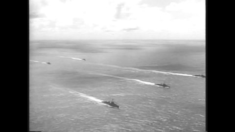 CIRCA 1962 - US Navy ships are seen to block Cuba from receiving Soviet weapons, and Castro puts his military on alert to fight back.