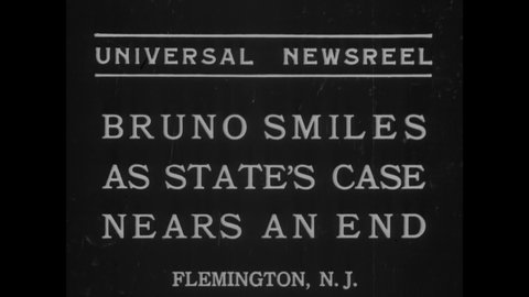 CIRCA 1935 - Bruno Richard Hauptmann, the prime suspect in the Lindbergh baby kidnapping case, smiles for photographers as the case comes to a close.