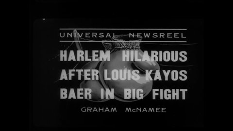 CIRCA 1935 - Residents of Harlem cheer after a boxing match where Joe Louis defeated Max Baer, and the boxers are seen afterwards.