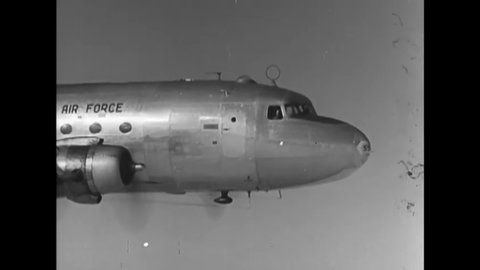 CIRCA 1948 - USAF C-54s are flown over Berlin with supplies, and candy is dropped to waiting children as part of Operation Little Vittles.