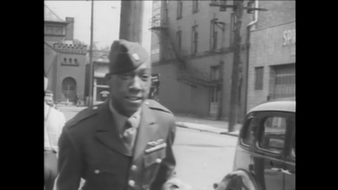 CIRCA 1945 - An African-American lieutenant honorably discharged on the point system returns home to Columbus, Ohio.