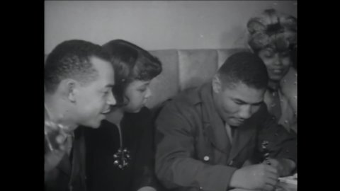 CIRCA 1945 - Boxing champ Beau Jack receives a formal education through the army, boxes with other soldiers, and signs autographs for officers.
