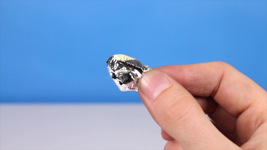 Holding solid Gallium (Ga) metal for science experiment