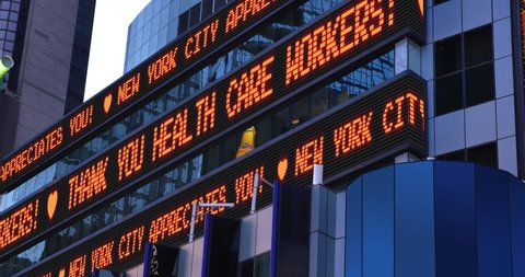 A fictional Times Square stock market ticker thanks health care workers during the COVID-19 pandemic of 2020. Custom messages available upon request.  	