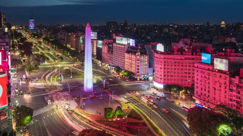 Night timelapse view of historical landmark Obelisk of Buenos Aires and traffic on 9 de Julio Avenue in Argentina, South America. Royalty-Free Stock Footage #1051519054