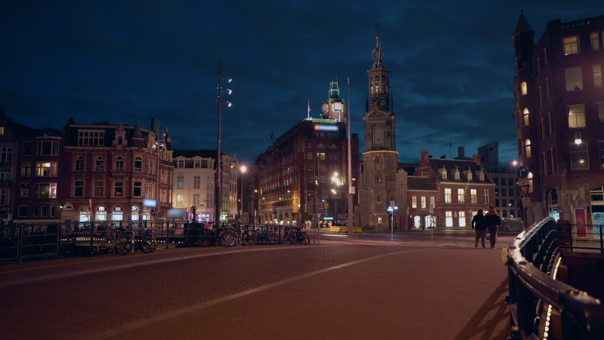 Amsterdam city downtown Netherlands at night, Netherlands. Historic houses, streets and evening lights