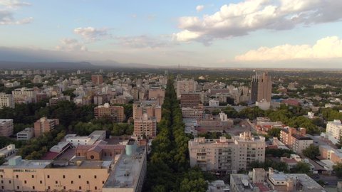 Aerial tilt down shot of long tree lined streets and residential buildings in downtown Mendoza, Argentina. The region around Greater Mendoza is the largest wine-producing area in South America.