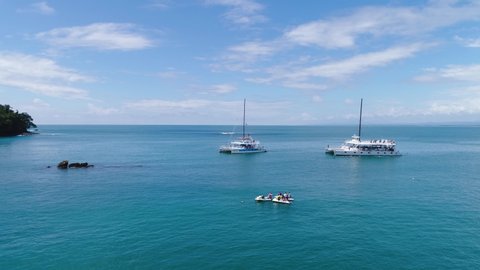 Manuel Antonio Costa Rica 02.11.2019 white catamaran yacht excursion in blue bay with empty beach Central America