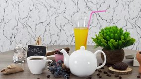 Cup of black coffee with juice glass and sweets on wooden table background. UHD.