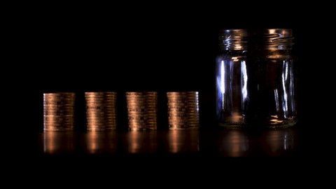 Financial investment and economic concept. Stop motion of Stack of golden coins in bar chart form on black background. Golden coins bar chart.