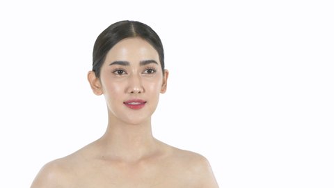 Beauty concept. A beautiful woman is gently caressing her face on a white background. 4k Resolution.