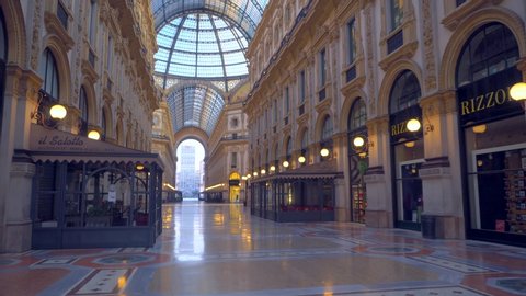 Milan, Italy, April 22, 2020: Vittorio Emanuele Gallery is empty of people and a tourist. Piazza Duomo. The quarantine from Covid19 in Italy. Quarantine in Milan. Closed luxury shops, bar, restaurants