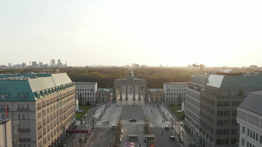 AERIAL: Brandenburger Tor with almost no People in Berlin, Germany due to Corona Virus COVID19 Pandemic in Beautiful Sunset Light