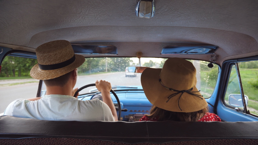 Young Couple Hats Riding Vintage Car 