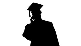 Silhouette Young graduate student making a call with smartphone with medical mask on. - Powered by Shutterstock - Get 15% off with code: PIKWIZARD15