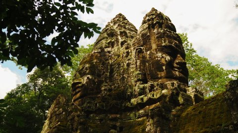 Parallax of Famous Smile Face Statue Of Bayon Temple in Angkor Thom, Siem Reap, Cambodia