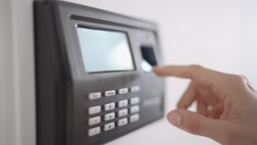 Closeup Woman Employee Using Biometric Fingerprint Attendance System Machine With Numeric Keypad at Work - Powered by Shutterstock - Get 15% off with code: PIKWIZARD15