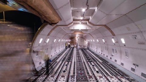 Loading air cargo inside aircraft cargo hold loop