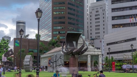 Singapore Raffles Place in the Central Business District Singapore timelapse hyperlapse, Singapore. Ship sculpture and entrance to metro station