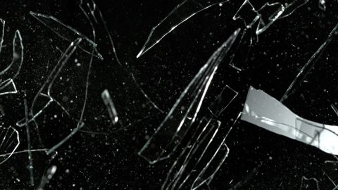 Super Slow Motion Shot of Real Glass Break at 1000 fps Isolated on Black Background.