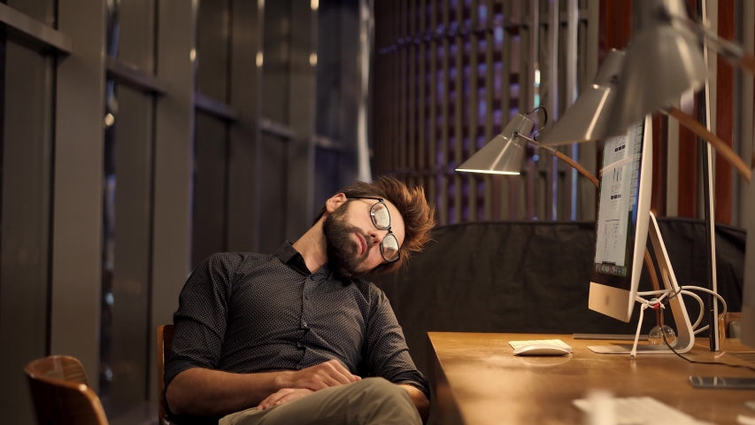 Office Work Overtime.Tired Businessman Sleeping On Workplace.Frustrated Businessman Working Alone. Workaholic Work In Internet Deadline.Tired Overwhelmed Exhausted Stressed Businessman In Night Office | Shutterstock HD Video #1051624756