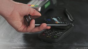 NFC Technology. The user makes contactless payment by mobile phone. Launches a smartphone to the pos terminal or credit card machine of cashless payment. Wireless payment nfc lifestyle. - Powered by Shutterstock - Get 15% off with code: PIKWIZARD15
