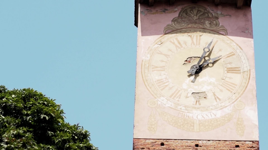 the dial on the bell tower in the old european town