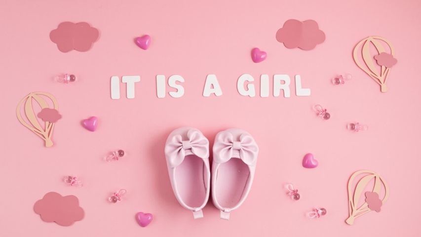 Cute newborn baby girl shoes with festive decoration over pink background. Baby shower, birthday, invitation or greeting card idea. Stop motion animation | Shutterstock HD Video #1051641613
