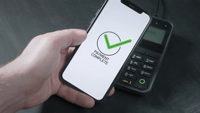 Pay by phone on the POS contactless payment terminal. A user makes a purchase using a smartphone in a store or restaurant. E-money at cashless wallet. - Powered by Shutterstock - Get 15% off with code: PIKWIZARD15