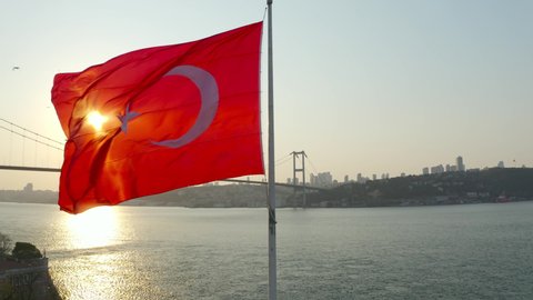 Aerial view of Istanbul Bosphorus and Turkish Flag.Istanbul Bosphorus Bridge (15 July Martyrs Bridge) and Historical Peninsula Landscape. 4K Footage in Turkey. 