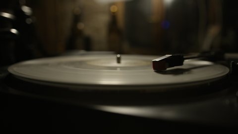 Macro of stylus needle on spinning vinyl record