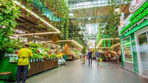 KAZAN, TATARSTAN/RUSSIA - DECEMBER 20 2019: Motion along modern supermarket with lots of different fresh food products and walking customers timelapse on December 20 in Kazan