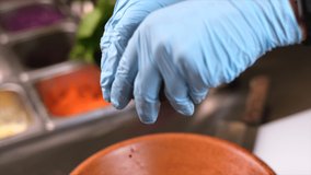A cook knocks grains from pomegranate into a salad. The cook takes out grains from pomegranate for salad with quinoa     - Powered by Shutterstock - Get 15% off with code: PIKWIZARD15