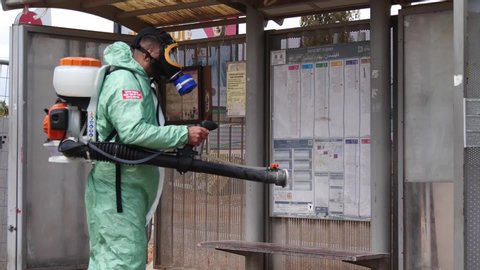 Corona epidemic.
A person disinfects a Corona virus bus stop. The picture was taken in Israel in the city of Kfar Saba in March 2020