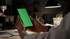 Green Screen and Chroma Key of Smartphone. Businessman Holding Smart Phone in Hands and Reading Messages or Web Blog Close-Up. Work Content at Office Worker Equipment. Greenscreen of Chromakey Mockup