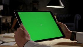 Green Screen and Chroma Key of Tablet Computer. Business Man Holding Mobile PC Close-Up. Greenscreen of Chromakey Mockup with Tracking Markers. Office Worker Shopping at Web Store or Working on Pad