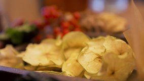 Close up of the table with dried slices of apples, red cranberries, mint leaves, and walnuts. Stock. Healthy vegan diet and nutrition concept, fruits, berries, and nuts lying on the table. - Powered by Shutterstock - Get 15% off with code: PIKWIZARD15