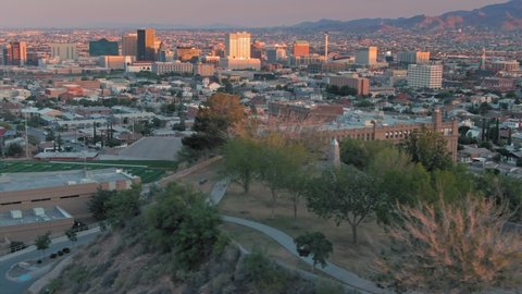 Aerial: El Paso suburbs, downtown & Tom Lea Upper Park at sunset. Texas, USA 