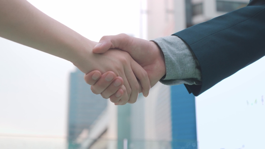 Business partnership meeting concept. Image businessman handshake. Successful businessmen handshaking after good deal. Horizontal. | Shutterstock HD Video #1051717240