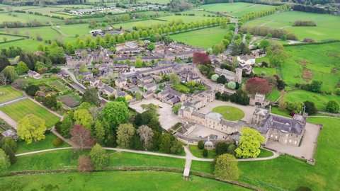 Aerial footage of the small village of Ripley in Harrogate, North Yorkshire in the UK showing the historical British Ripley Castle Wedding Venue along side the Ripley Lake