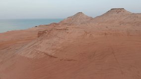 FPV style video: Amazing desert rock formation on an island in the middle east. Abu Dhabi, United Arab Emirates. 