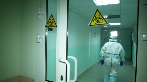 Chelyabinsk, Chelyabinsk region / Russia-04.01.2020:
Doctor in a protective uniform enters the infectious diseases Department, walks through the hospital.
Coronavirus and covid-19, health concept.