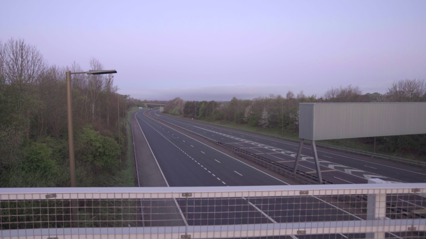 Empty motorway during Covid 19 Coronavirus lockdown. Quarantine in Edinburgh, M8, Scotland, UK. | Shutterstock HD Video #1051732948