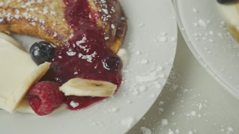 Brunch french toast with berry marmalade, cheese cream and banana